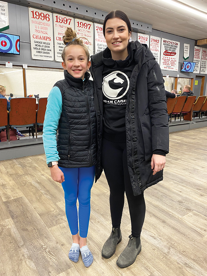 A young Maryfield curler happy to get her picture taken with Rachel Erickson.”></a><br />
<p class=